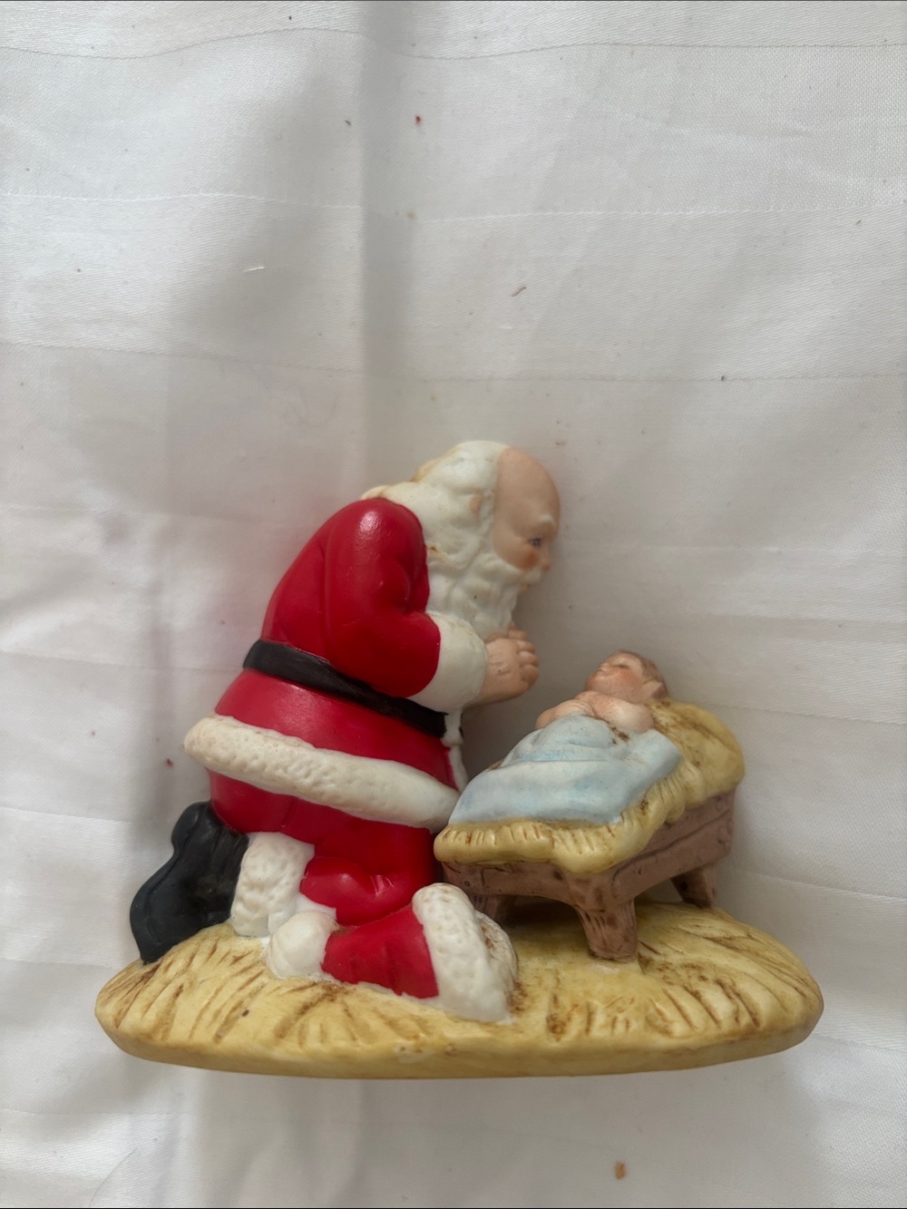 Classic Santa Kneeling by Manger Holiday Figurine - Red